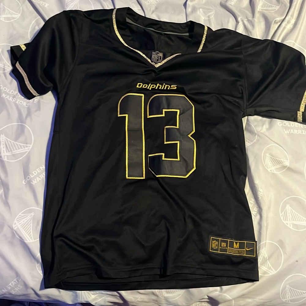 Black and gold Miami dolphins jersey, men’s medium, never worn.